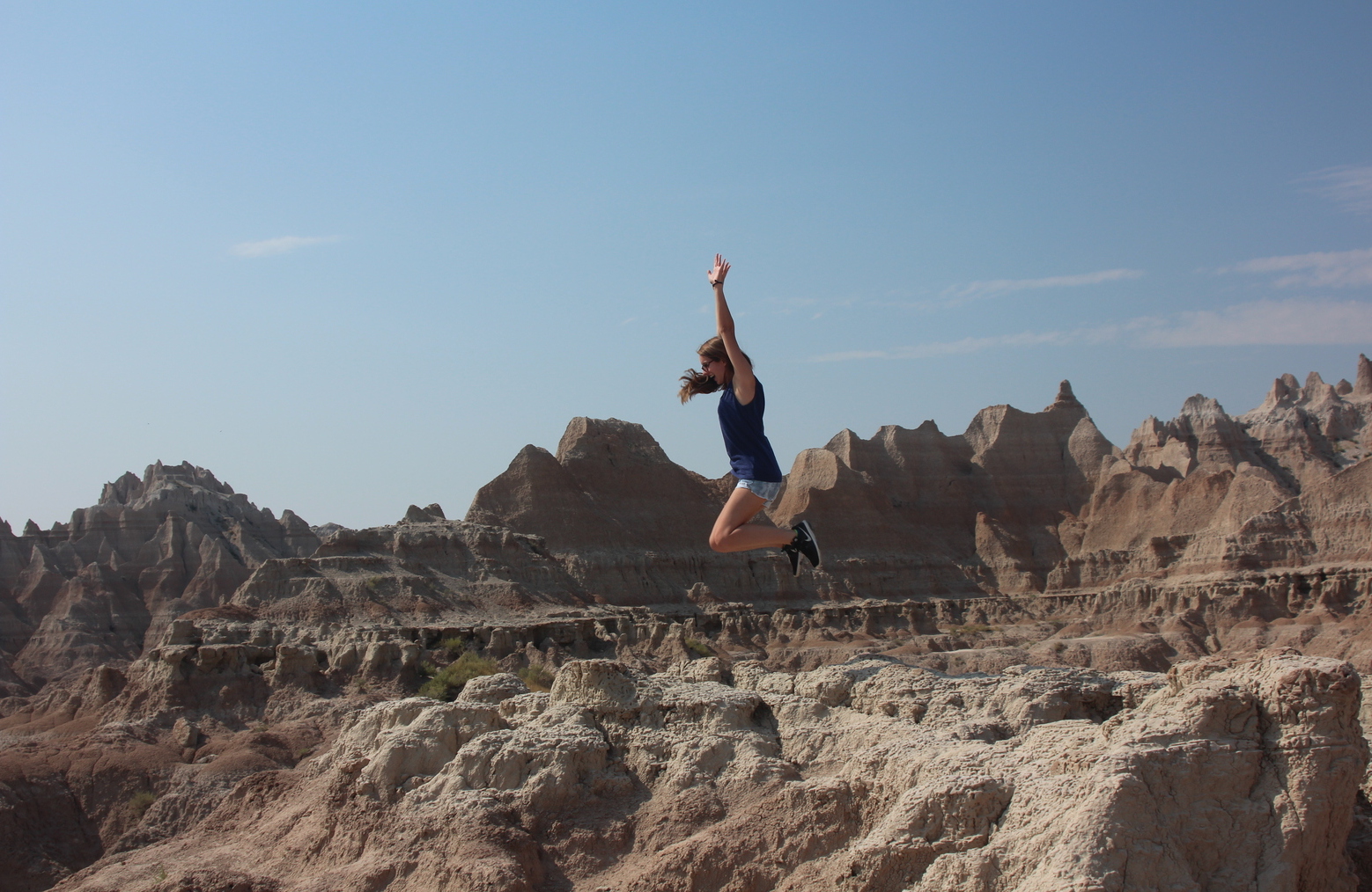Student jumping at Badlands National Park