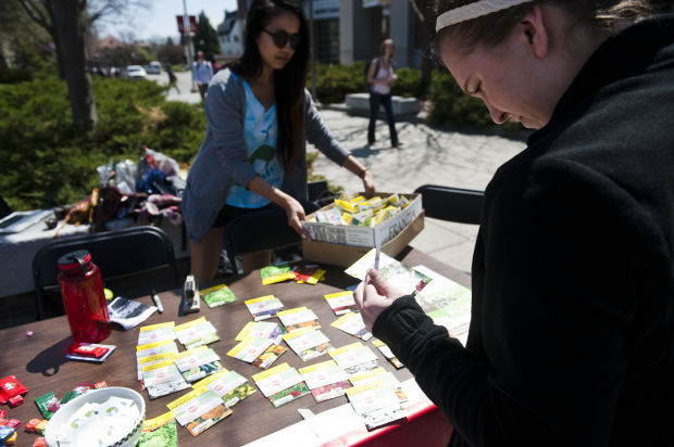 Photo Credit: Environmental Sustainability Committee members at UNL hand out flower seeds during an Earth Day event.