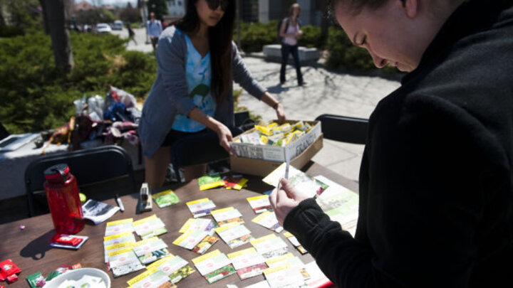 Environmental Sustainability Committee members at UNL hand out flower seeds during an Earth Day event.